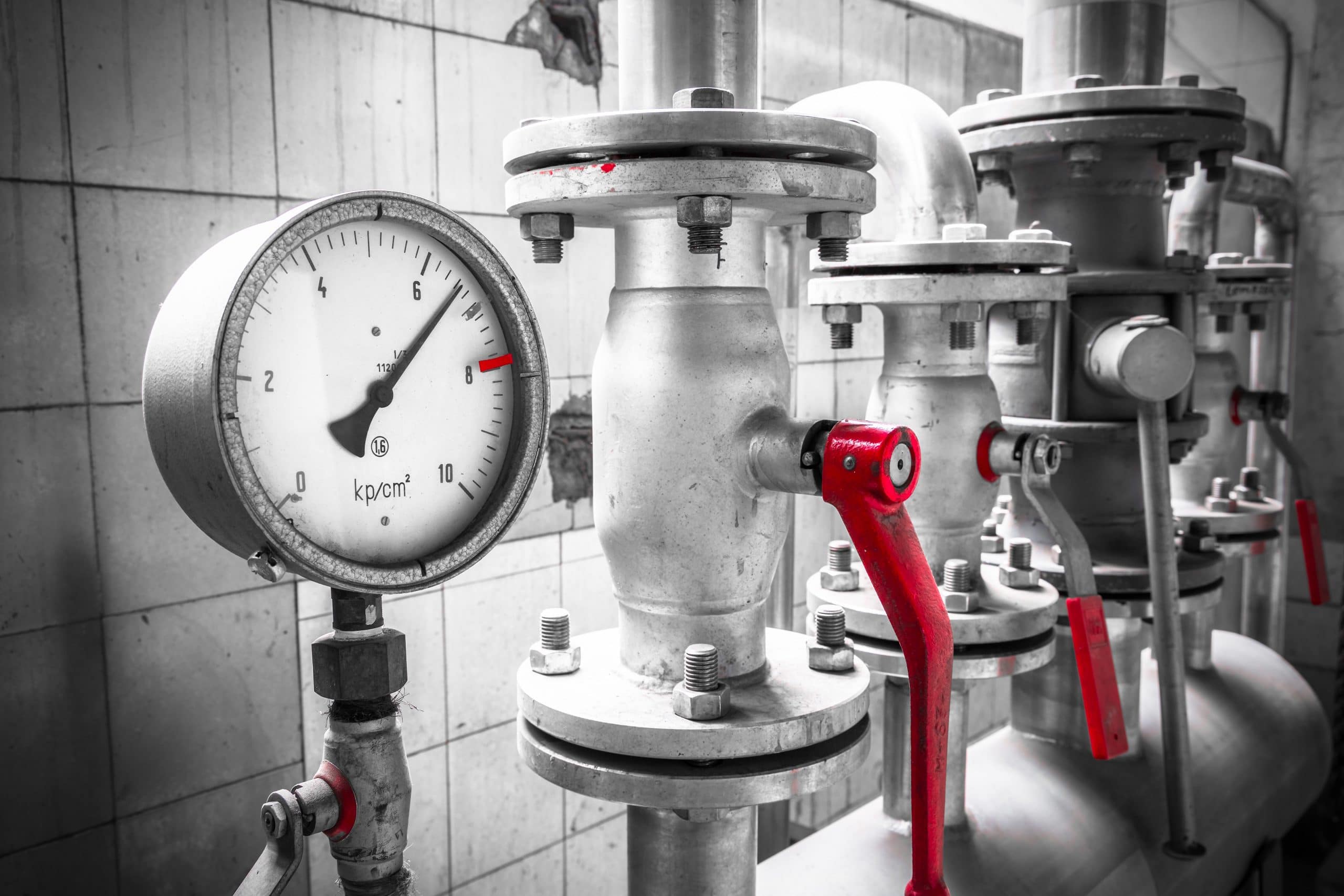 Stylish image of pressure gauge and vales in plant room