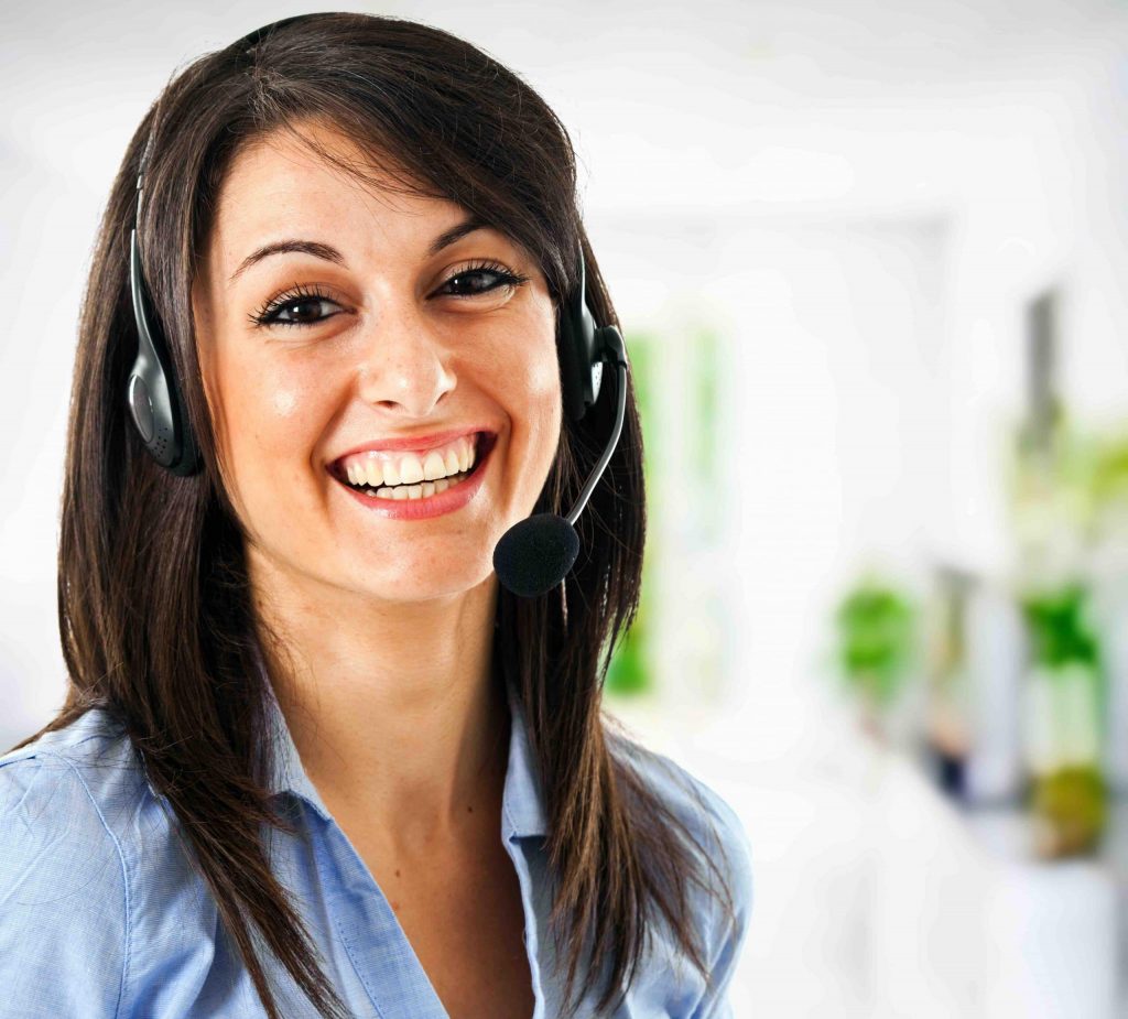 Smiling female customer support assistant wearing phone headset