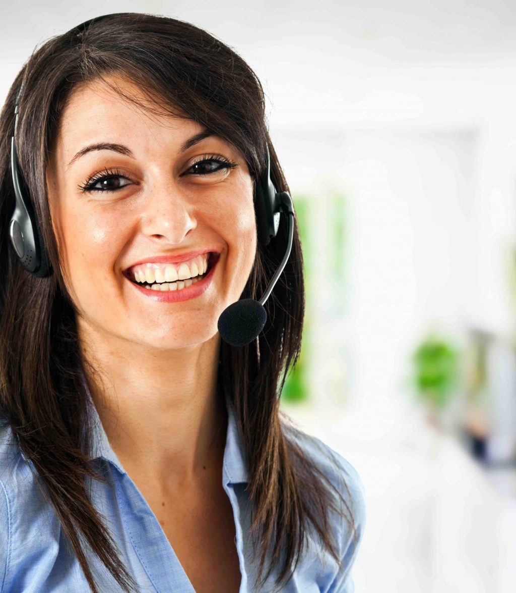 Smiling female customer support assistant wearing phone headset